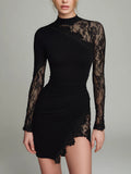 Asymmetrical mini dress made of black tulle with lace and an elegant high collar